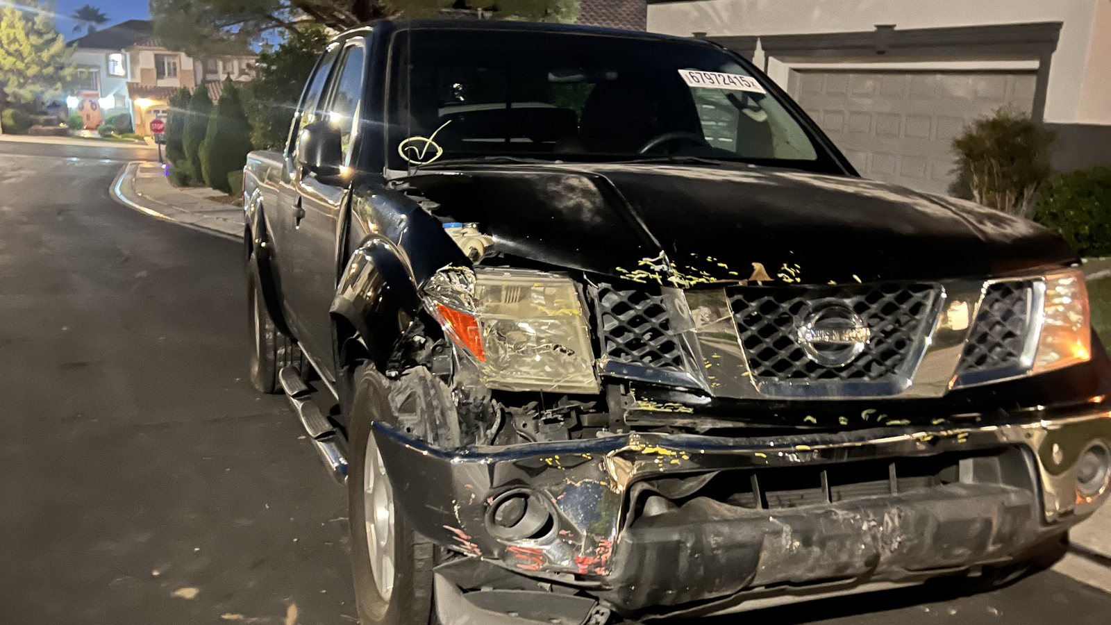 Before: Nissan Frontier with front-corner collision damage
