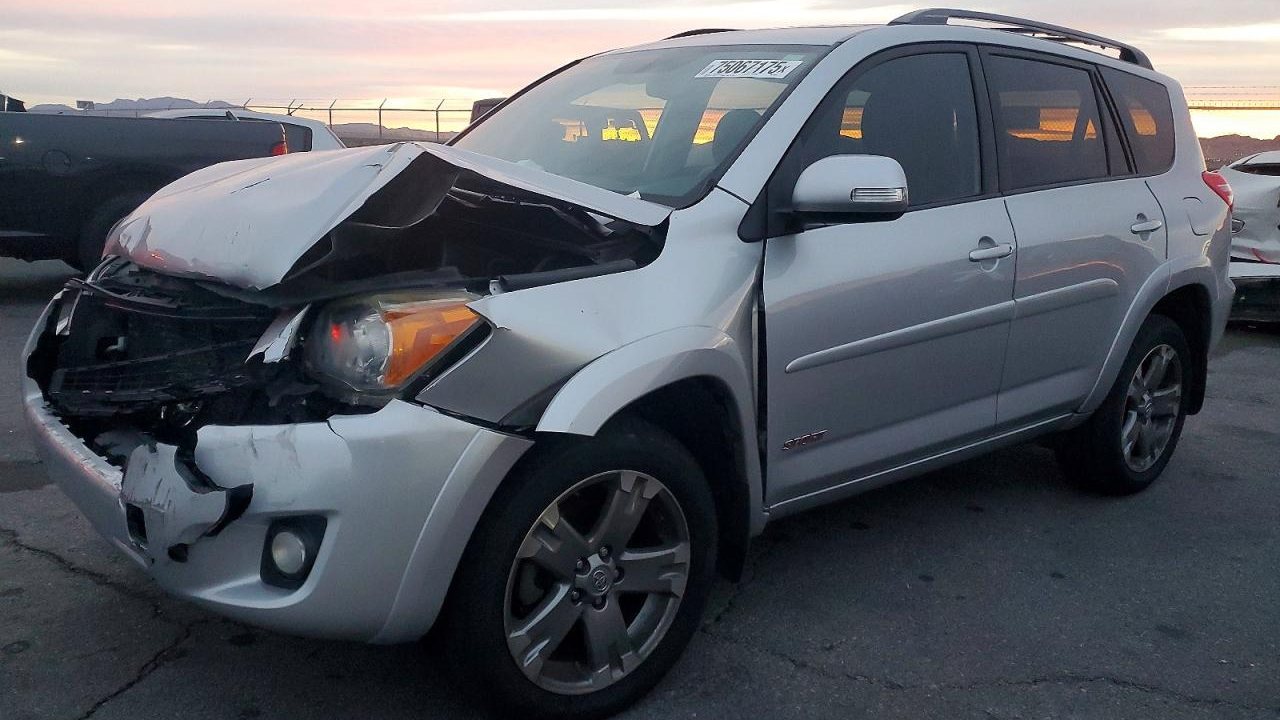 Before: Toyota RAV4 with severe front-end collision damage from insurance auction